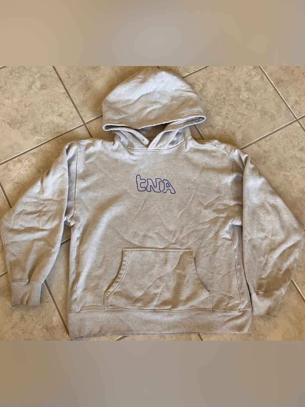 TNA Light Gray oversized Hoodie with blue Outline Logo